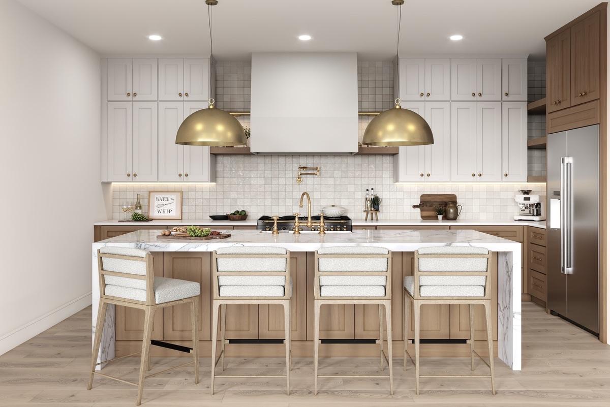 White shaker upper cabinets with natural oak island